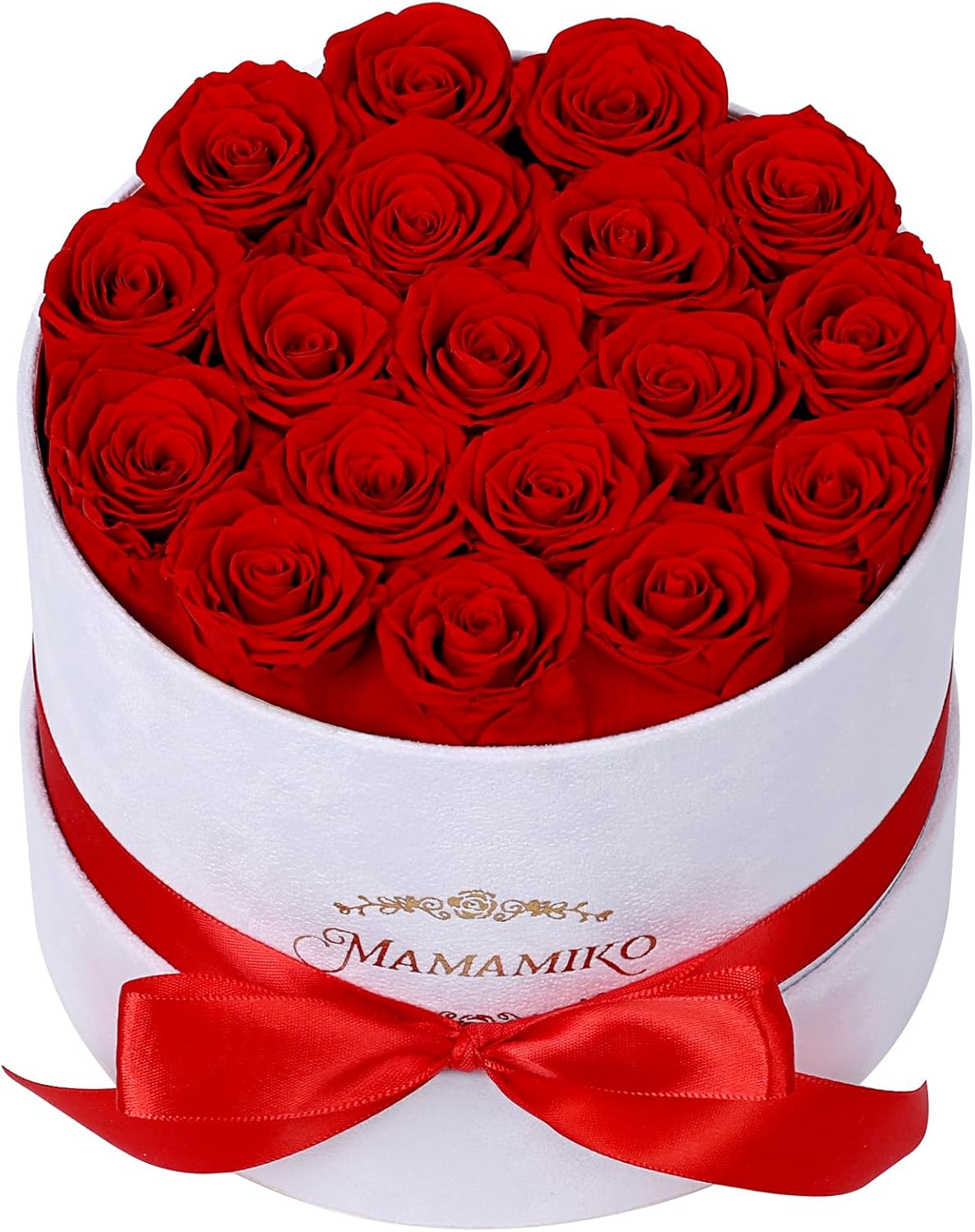 A round white box filled with red roses, tied with a red ribbon.